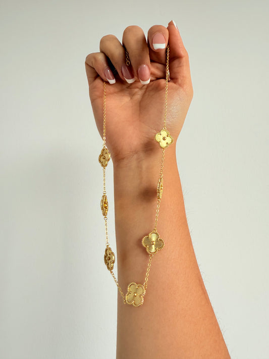 Cadena flor  varios dijes DORADO